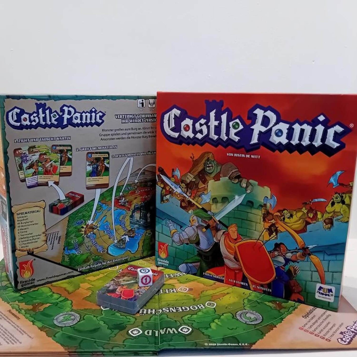 Castle Panic cooperative board game with box and game components for defending the castle against monsters.
