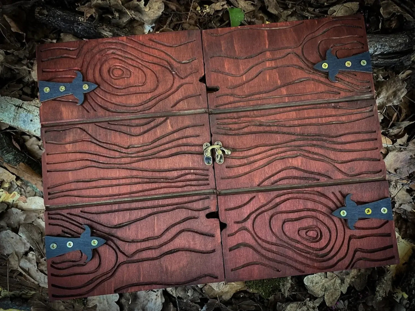 Handcrafted wooden dungeon master screen with intricate wood grain and metal clasps, ideal for RPG sessions.