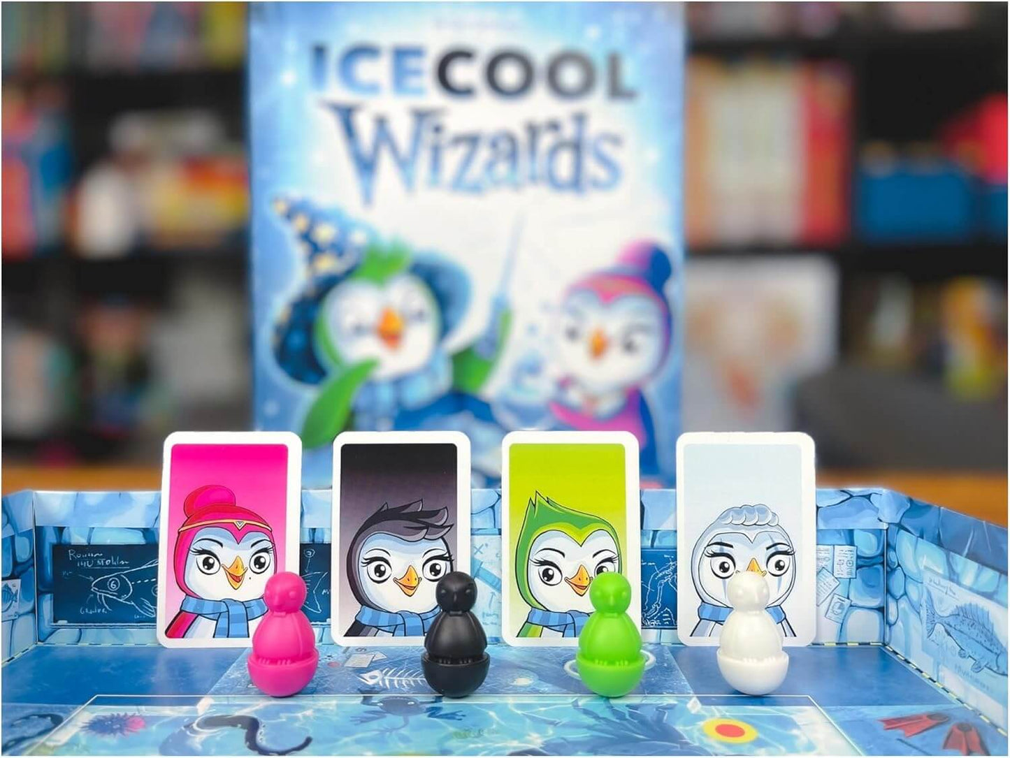 Ice Cool Wizards family game showing colorful penguin pieces and cards on an ice-themed board.