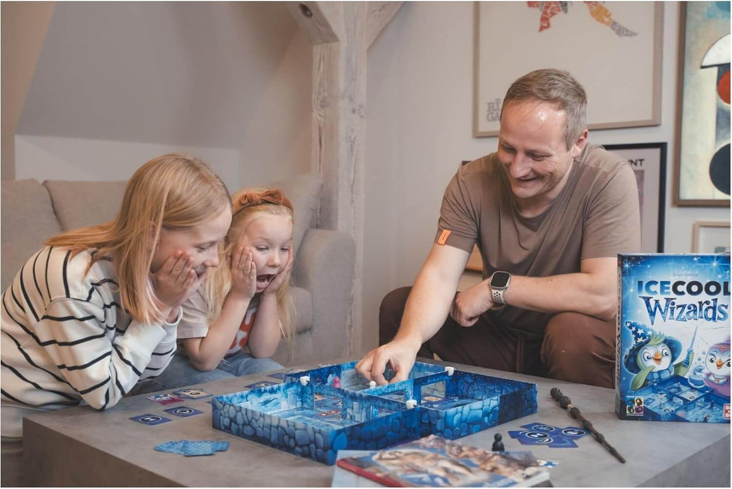 Families enjoying Ice Cool Wizards board game, featuring magical penguins and ice school fun.