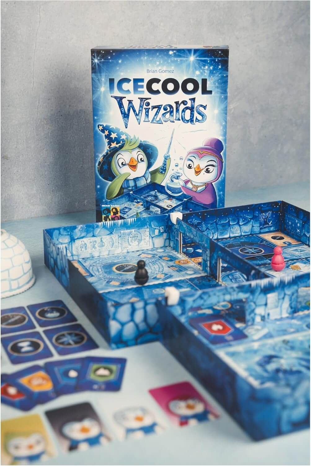 Ice Cool Wizards board game with colorful penguin characters and ice-themed game components.