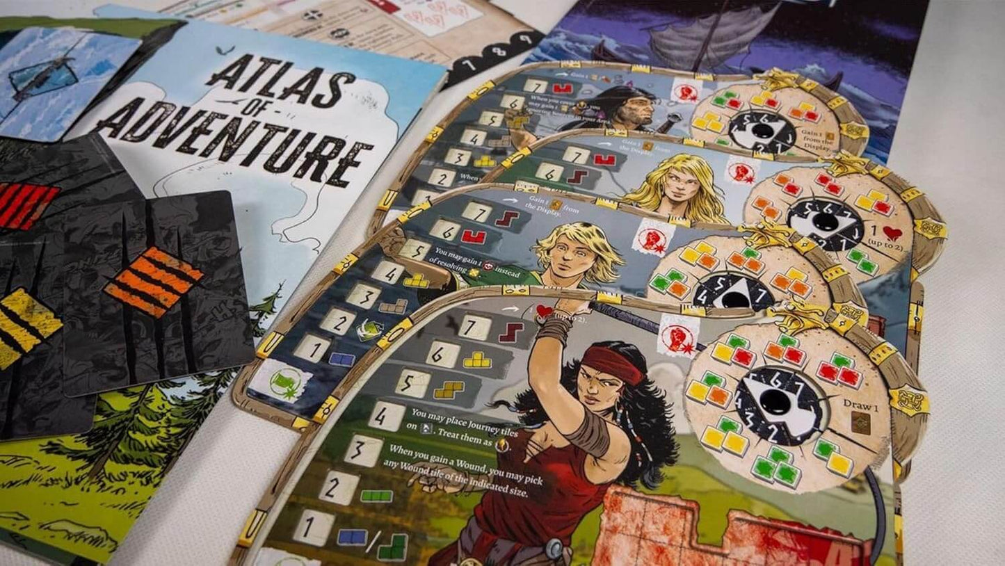 Close-up of Thorgal board game components, including character boards and game map, highlighting adventure and strategy elements.