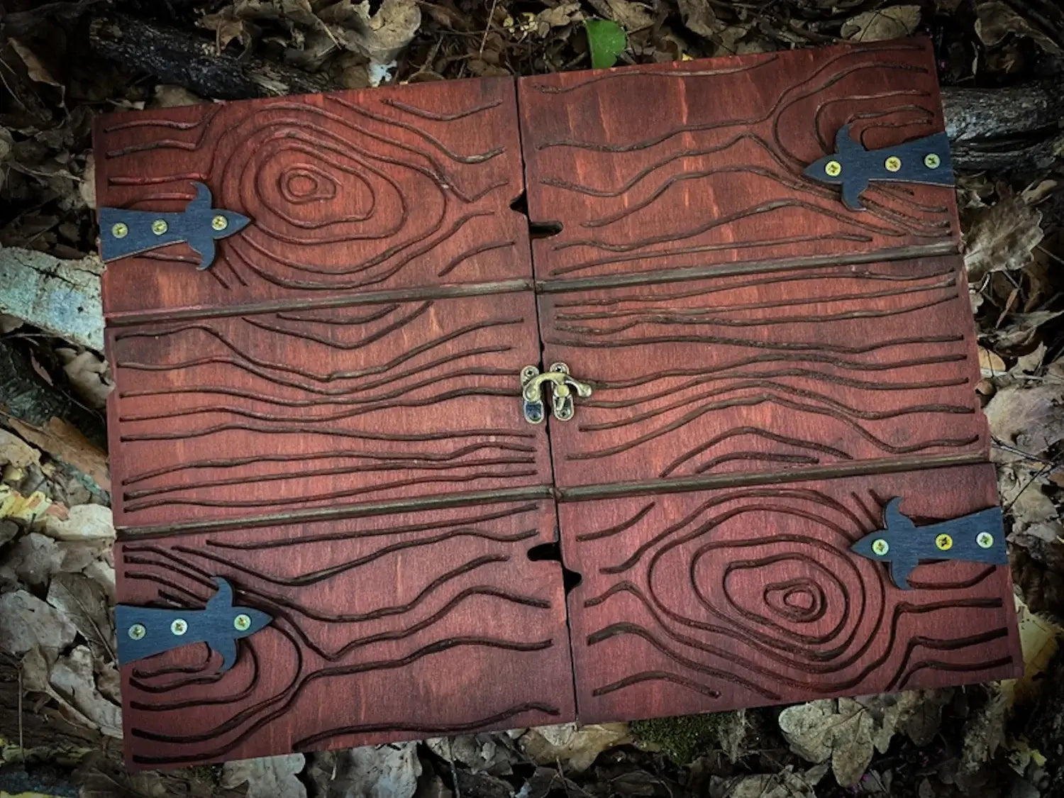 Handcrafted wooden dungeon master screen with intricate wood grain and metal clasps, ideal for RPG sessions.
