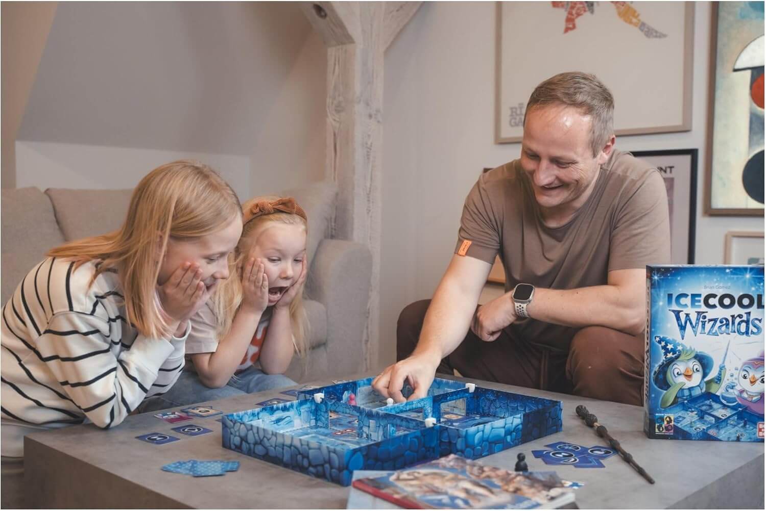 Families enjoying Ice Cool Wizards board game, featuring magical penguins and ice school fun.